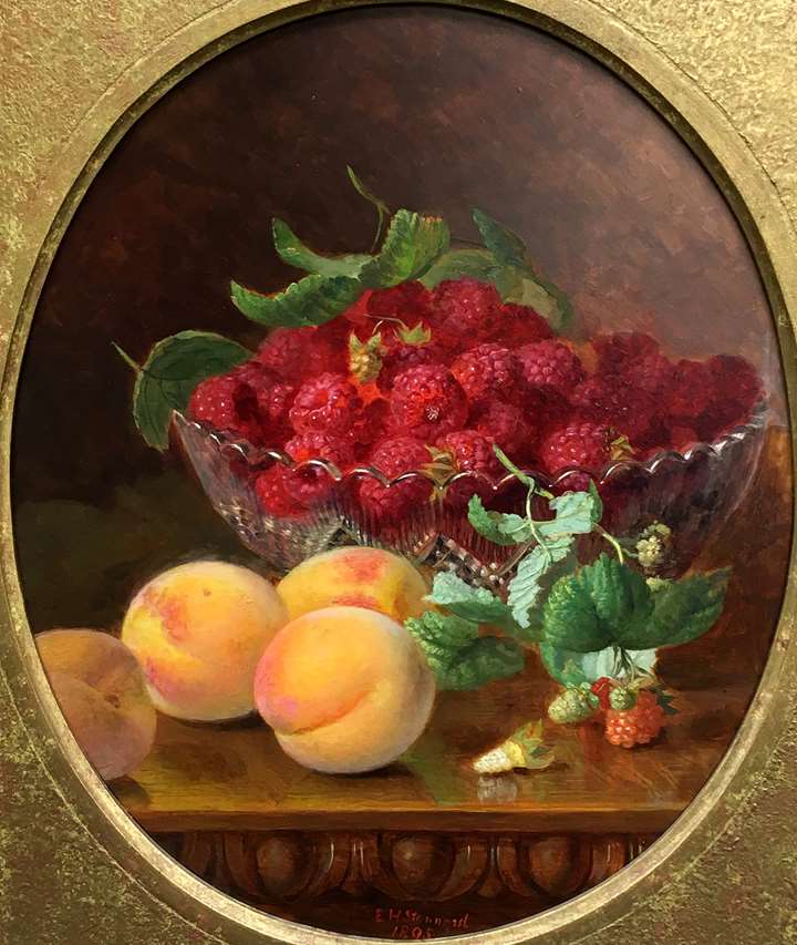 Raspberries and peaches on a table 
